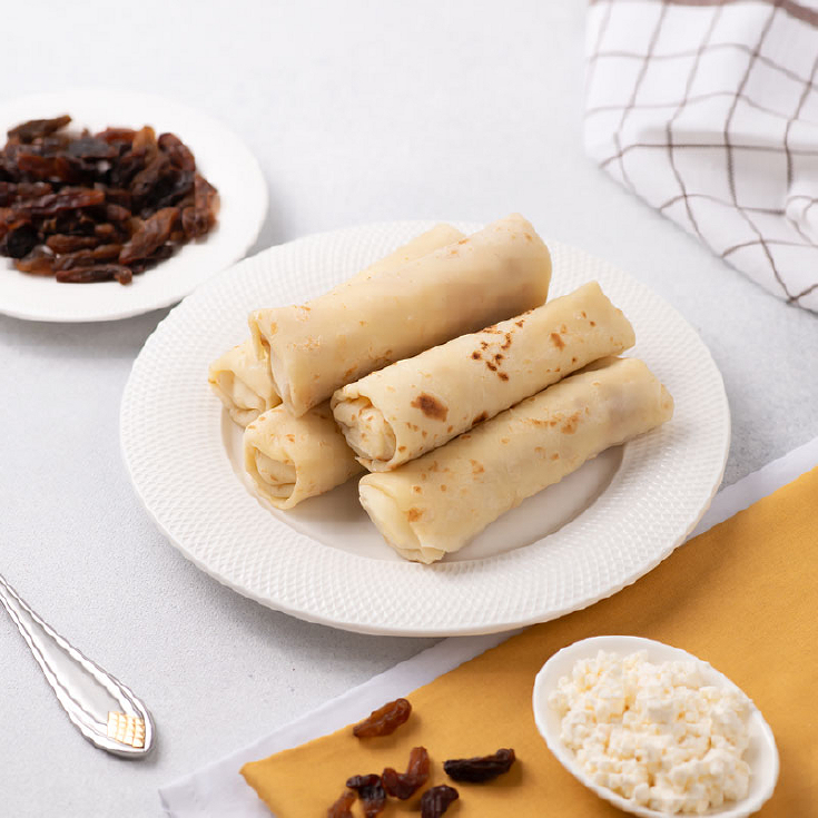 Млинці з сиром та родзинками